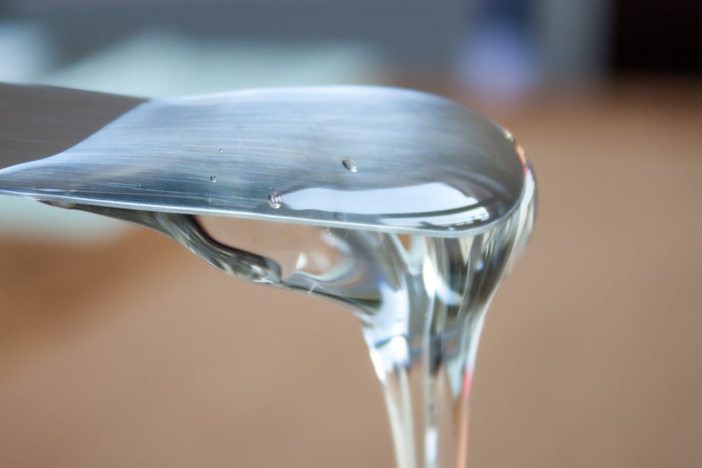 Glucose,Syrop,Confectionary,Pouring,From,Spatula.,Clear,Thick,Liquid.