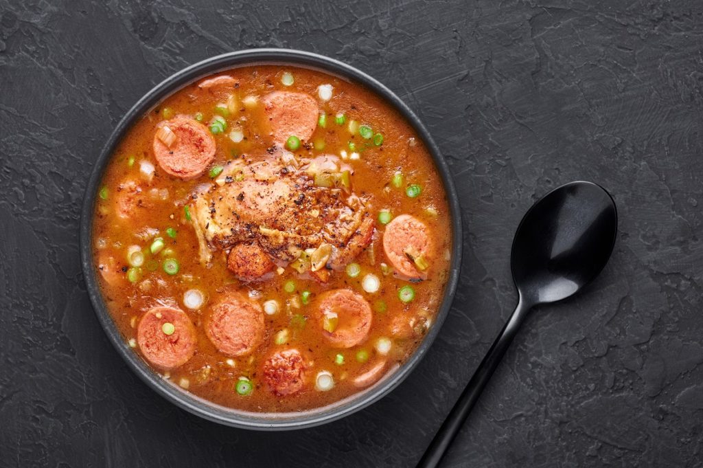 Chicken,And,Sausage,Gumbo,Soup,In,Black,Bowl,On,Dark